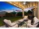 This covered patio has string lights and ample seating at 3123 E Buena Vista Dr, Chandler, AZ 85249