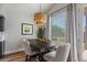 Elegant dining area features a stylish light fixture, comfortable seating, and natural light at 3123 E Buena Vista Dr, Chandler, AZ 85249
