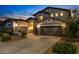 Beautiful home with a three-car garage, stone accents, and well-maintained landscaping at 3123 E Buena Vista Dr, Chandler, AZ 85249