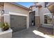 Home with a three-car garage, stone veneer, and walkway to front door at 3123 E Buena Vista Dr, Chandler, AZ 85249