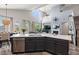 Open kitchen concept with stainless appliances, island seating and seamless flow to living area at 3123 E Buena Vista Dr, Chandler, AZ 85249