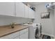 This laundry room has cabinets, a counter, and washer and dryer at 3123 E Buena Vista Dr, Chandler, AZ 85249
