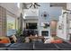 Bright living room features soaring ceilings, a cozy fireplace, and stylish furnishings at 3123 E Buena Vista Dr, Chandler, AZ 85249