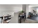 Loft area with desk, chair, and exercise equipment; downstairs is a kitchen with dark blue cabinets at 3123 E Buena Vista Dr, Chandler, AZ 85249
