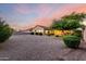 Large backyard with desert landscaping, brick accents, and a well-maintained lawn at 31502 N 58Th Pl, Cave Creek, AZ 85331