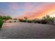 Desert landscaped backyard with mature plantings and a perimeter fence at 31502 N 58Th Pl, Cave Creek, AZ 85331