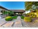 Beautiful backyard featuring a covered patio, desert landscaping, and a well-maintained lawn at 31502 N 58Th Pl, Cave Creek, AZ 85331