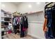 Spacious walk-in closet offering plenty of storage with rods, shelves, and organizing containers at 31502 N 58Th Pl, Cave Creek, AZ 85331