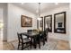 Elegant dining room features a stylish dark wood table, mirrors, and a decorative rug at 31502 N 58Th Pl, Cave Creek, AZ 85331