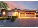 Charming single-Gathering home with a three car garage, stone accents, and manicured landscaping in front yard at 31502 N 58Th Pl, Cave Creek, AZ 85331