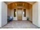 Inviting front porch with decorative seating and a well-maintained walkway at 31502 N 58Th Pl, Cave Creek, AZ 85331