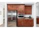 Well-equipped kitchen featuring stainless steel refrigerator and built-in microwave at 31502 N 58Th Pl, Cave Creek, AZ 85331