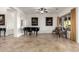 Open living area featuring a grand piano, elegant decor, and plenty of natural light at 31502 N 58Th Pl, Cave Creek, AZ 85331