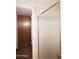 Shower stall with sliding glass doors, and a glimpse of a wood-paneled bathroom door at 3202 W Joan De Arc W Ave, Phoenix, AZ 85029