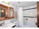 Bathroom with a shower/tub combo, a toilet, a sink, and a mirror at 3202 W Joan De Arc W Ave, Phoenix, AZ 85029
