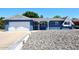 Charming blue single-story home with white trim, a stone yard, and a well-maintained front yard at 3202 W Joan De Arc W Ave, Phoenix, AZ 85029