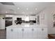 Modern kitchen with stainless steel appliances, sleek white cabinetry, a large island, and recessed lighting at 3202 W Joan De Arc W Ave, Phoenix, AZ 85029