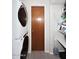 Functional laundry area with washer, dryer, storage shelves, and a clean, organized space at 3202 W Joan De Arc W Ave, Phoenix, AZ 85029
