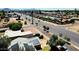Neighborhood aerial shot highlighting mature trees, wide streets, and mountain views in the distance at 3708 W Peoria Ave, Phoenix, AZ 85029
