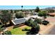 Aerial view of backyard featuring green lawn, brick exterior, and solar panels at 3708 W Peoria Ave, Phoenix, AZ 85029