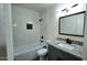 Tastefully remodeled bathroom featuring a granite vanity, new fixtures, and stylish tiled walls, offering a modern and fresh look at 3708 W Peoria Ave, Phoenix, AZ 85029