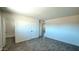 A bright bedroom features wood-look floors, white walls, and has multiple doorways at 3708 W Peoria Ave, Phoenix, AZ 85029