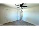 A clean bedroom offers a ceiling fan, neutral walls, and wood-look floors at 3708 W Peoria Ave, Phoenix, AZ 85029
