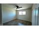 Cozy bedroom with a ceiling fan and natural light from a window at 3708 W Peoria Ave, Phoenix, AZ 85029