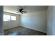 Bedroom featuring wood-look flooring, a ceiling fan, and a bright window at 3708 W Peoria Ave, Phoenix, AZ 85029