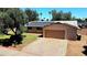 Front exterior of house featuring brick facade, solar panels, and a well-kept lawn at 3708 W Peoria Ave, Phoenix, AZ 85029