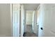 Hallway featuring a closet and bedroom entrances at 3708 W Peoria Ave, Phoenix, AZ 85029
