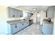 Well-equipped kitchen with plenty of storage, gray cabinets, modern appliances, and granite countertops at 3708 W Peoria Ave, Phoenix, AZ 85029