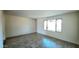 Spacious living room with natural light and modern wood-look tile flooring at 3708 W Peoria Ave, Phoenix, AZ 85029