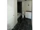 Bathroom featuring dark tile flooring, tub and white vanity with toilet at 3725 E Karen Dr, Phoenix, AZ 85032