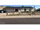 Single-story home with a front yard needing landscape and a two-car garage at 3725 E Karen Dr, Phoenix, AZ 85032