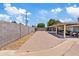 Expansive backyard featuring brick pavers, a covered patio, rock landscaping, and privacy fencing at 4026 W Berridge W Ln, Phoenix, AZ 85019