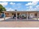 Spacious brick-paved backyard featuring a covered patio and storage, with exterior access at 4026 W Berridge W Ln, Phoenix, AZ 85019