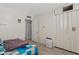 Bedroom with a double folding door closet and a blue checkered blanket at 4026 W Berridge W Ln, Phoenix, AZ 85019