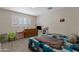 Bedroom with a window and a bed with a blue checkered blanket at 4026 W Berridge W Ln, Phoenix, AZ 85019