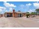 Single-story brick home with a spacious front yard and a convenient carport at 4026 W Berridge W Ln, Phoenix, AZ 85019