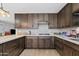 Updated kitchen features modern cabinetry, countertops, and stainless steel appliances, perfect for cooking at 4026 W Berridge W Ln, Phoenix, AZ 85019