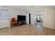 Another view of the living room, showcasing tile flooring and access to the outside at 4026 W Berridge W Ln, Phoenix, AZ 85019