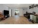 Cozy living room with a leather sofa, tile floors, and sliding glass doors at 4026 W Berridge W Ln, Phoenix, AZ 85019