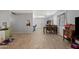 Open-plan living and dining area with tile floors and a view of the front door at 4026 W Berridge W Ln, Phoenix, AZ 85019