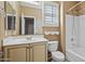 Well-lit bathroom featuring a vanity with cabinets, shower-tub combo, and a large mirror at 4169 E Jasper Dr, Gilbert, AZ 85296