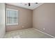Neutral bedroom with carpeted floor, window with shutters, and neutral paint at 4169 E Jasper Dr, Gilbert, AZ 85296