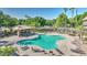 Overhead shot of Community pool with lounge chairs, shade, and lush landscape at 4169 E Jasper Dr, Gilbert, AZ 85296