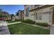 Townhome with lush green lawn and landscaping, situated on a sidewalk-lined street at 4169 E Jasper Dr, Gilbert, AZ 85296