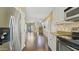 Bright, open kitchen with stainless steel appliances seamlessly flowing into a living area at 4169 E Jasper Dr, Gilbert, AZ 85296