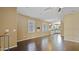 Open concept living space with dark hardwood floors, white shutters and neutral paint at 4169 E Jasper Dr, Gilbert, AZ 85296